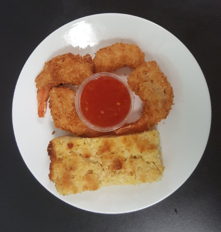 Coconut shrimp with pineapple stuffing and dipping sauce